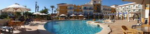 Seasonal outdoor pool, open 11:00 AM to 7:00 PM, pool loungers