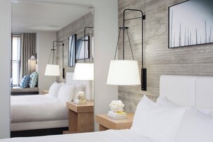 Premium bedding, down comforters, pillowtop beds, in-room safe