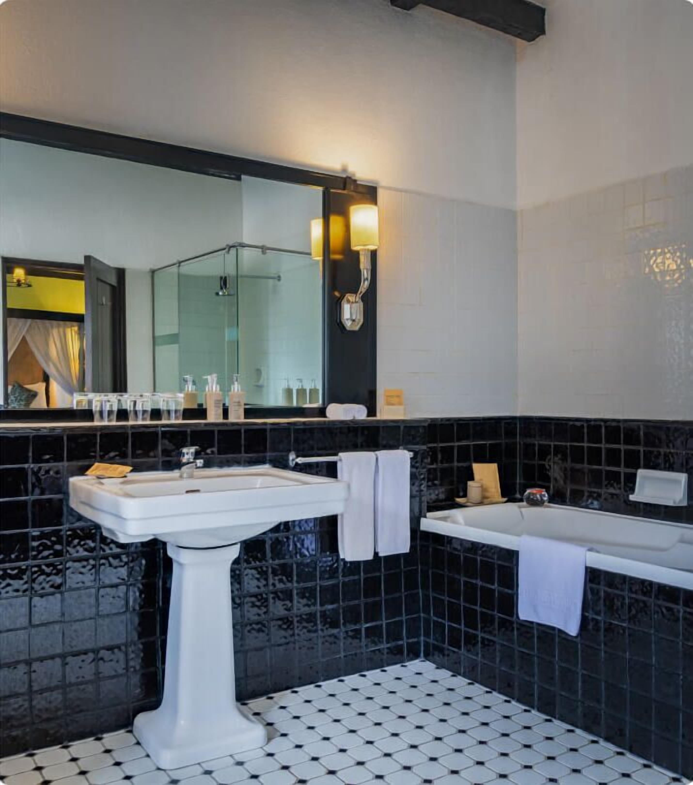 family suite | bathroom | separate bathtub and shower, free toiletries, hair dryer, bathrobes