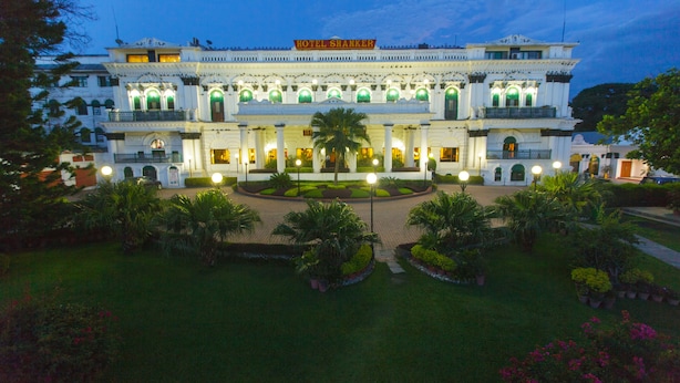 A large, ornate hotel with a grand entrance, multiple balconies, and a well-maintained garden. - Hotel Shanker-Palatial Heritage Kathmandu (Kathmandu)