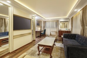 Suite | Living area | 24-inch LCD TV with cable channels, TV