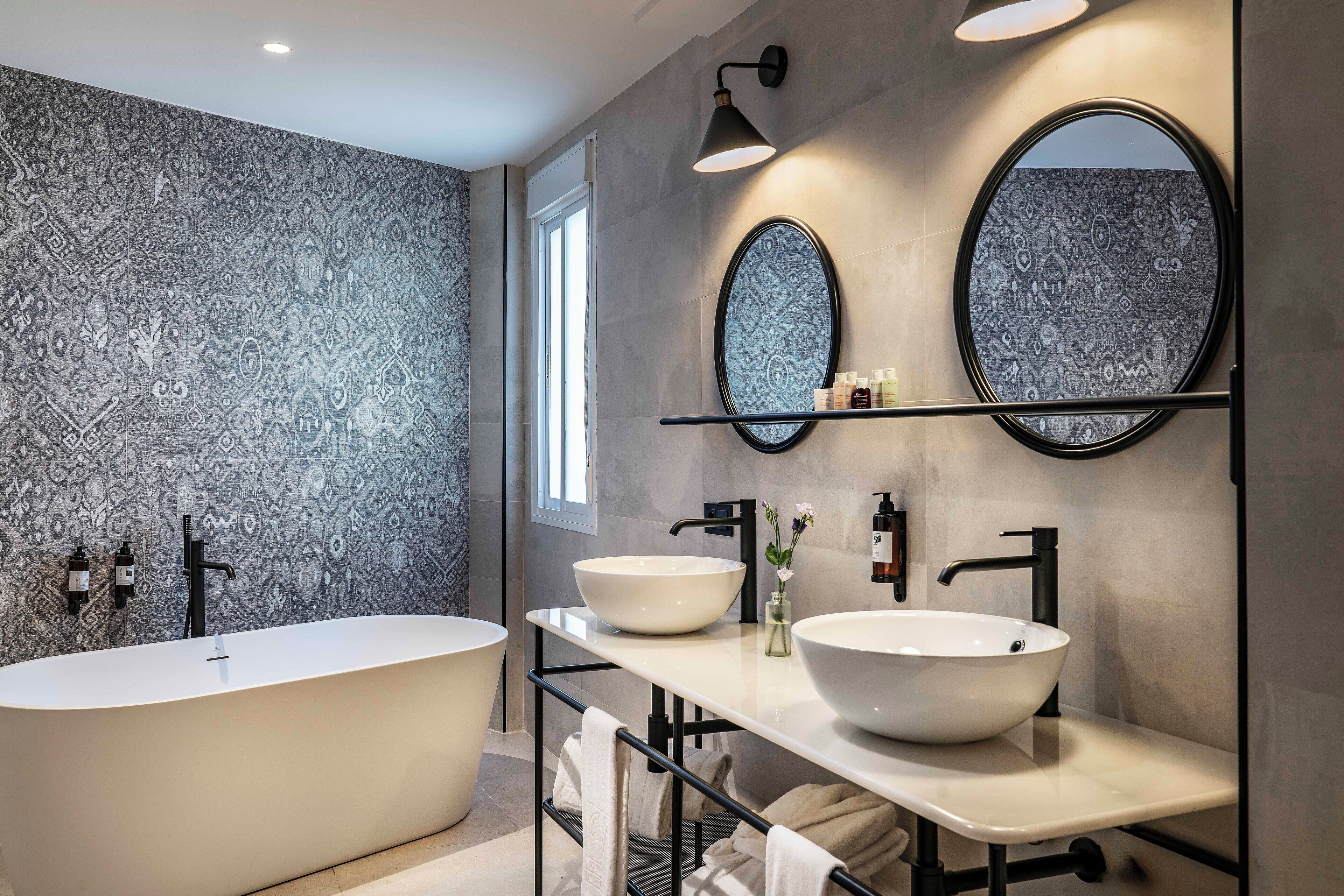 designer toiletries, hair dryer, towels, soap