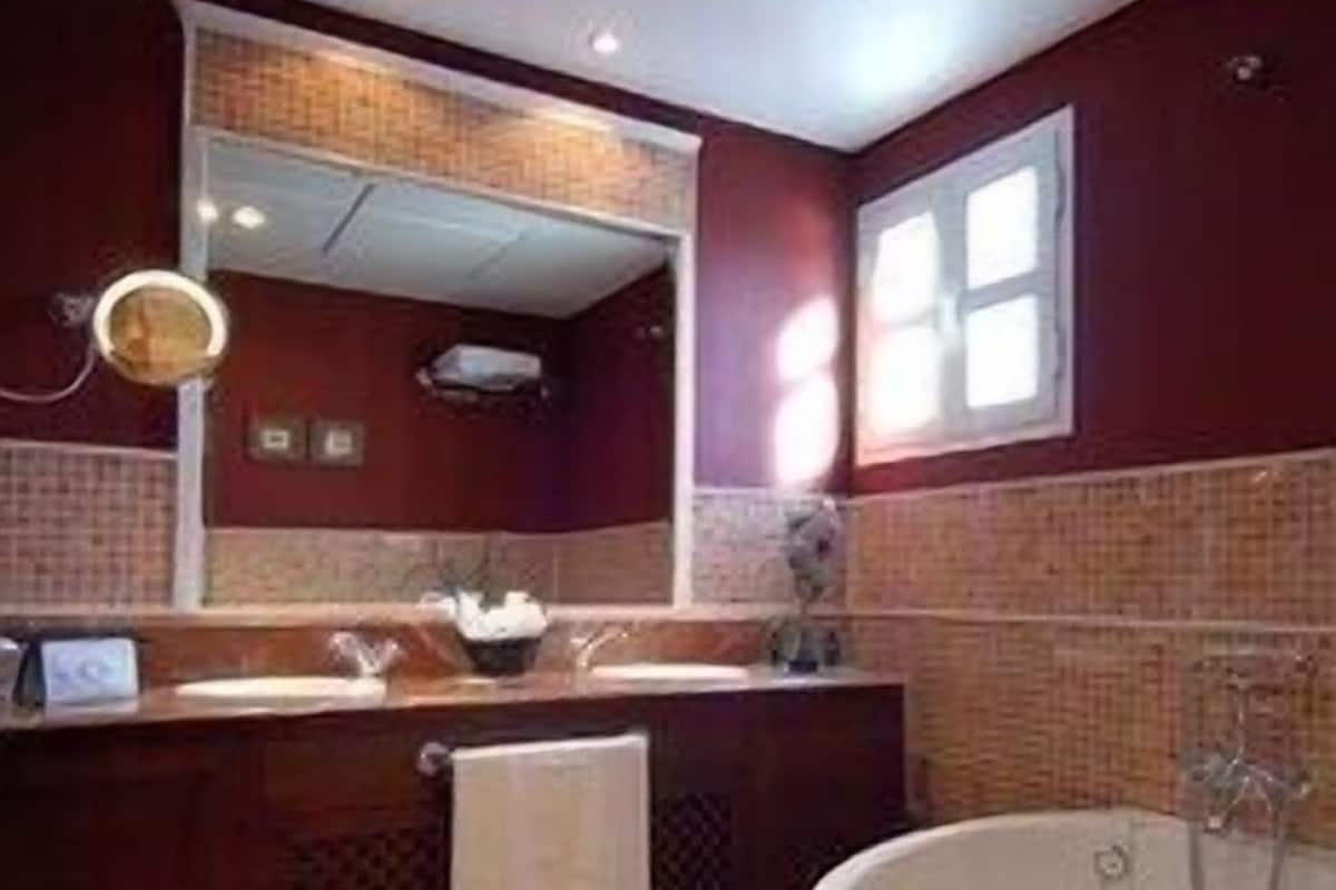 Bathroom | Designer toiletries, hair dryer, towels, soap