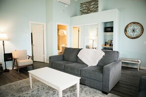 1 King Bed (Private Bedroom), 2 Queen Size Pullout Sofas | Living room | Flat-screen TV, fireplace