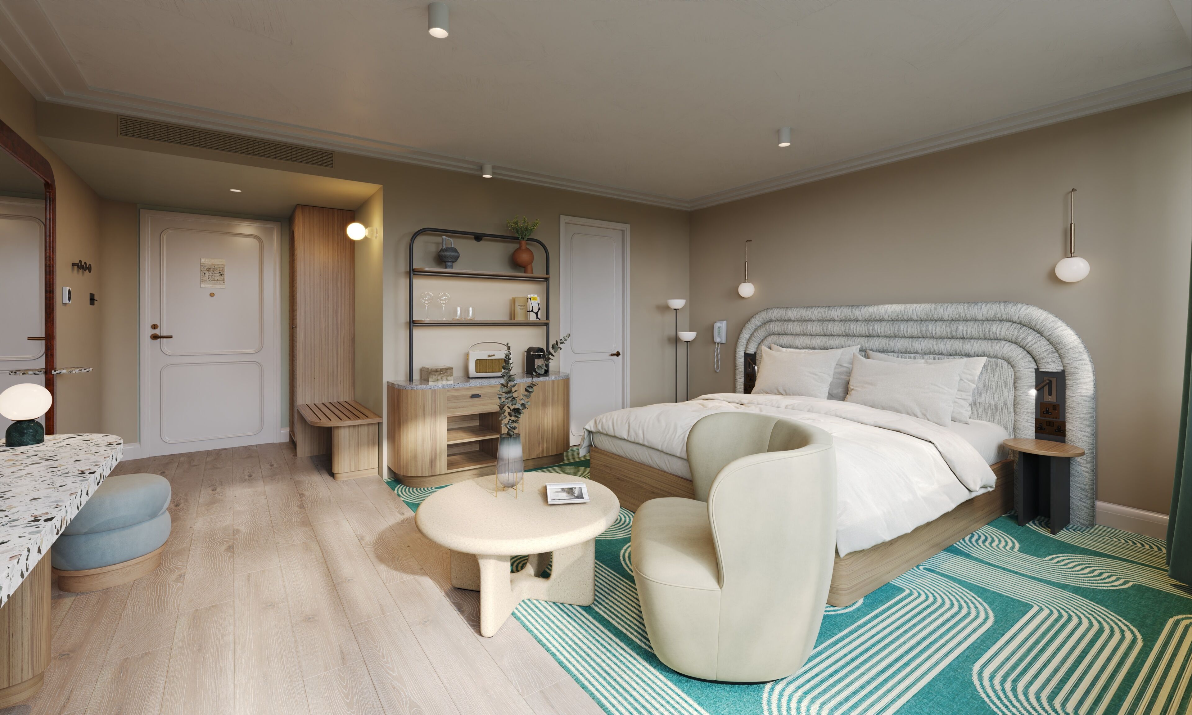 Een moderne slaapkamer met een bed, nachtkastje, stoel en een klein bureau met lamp.