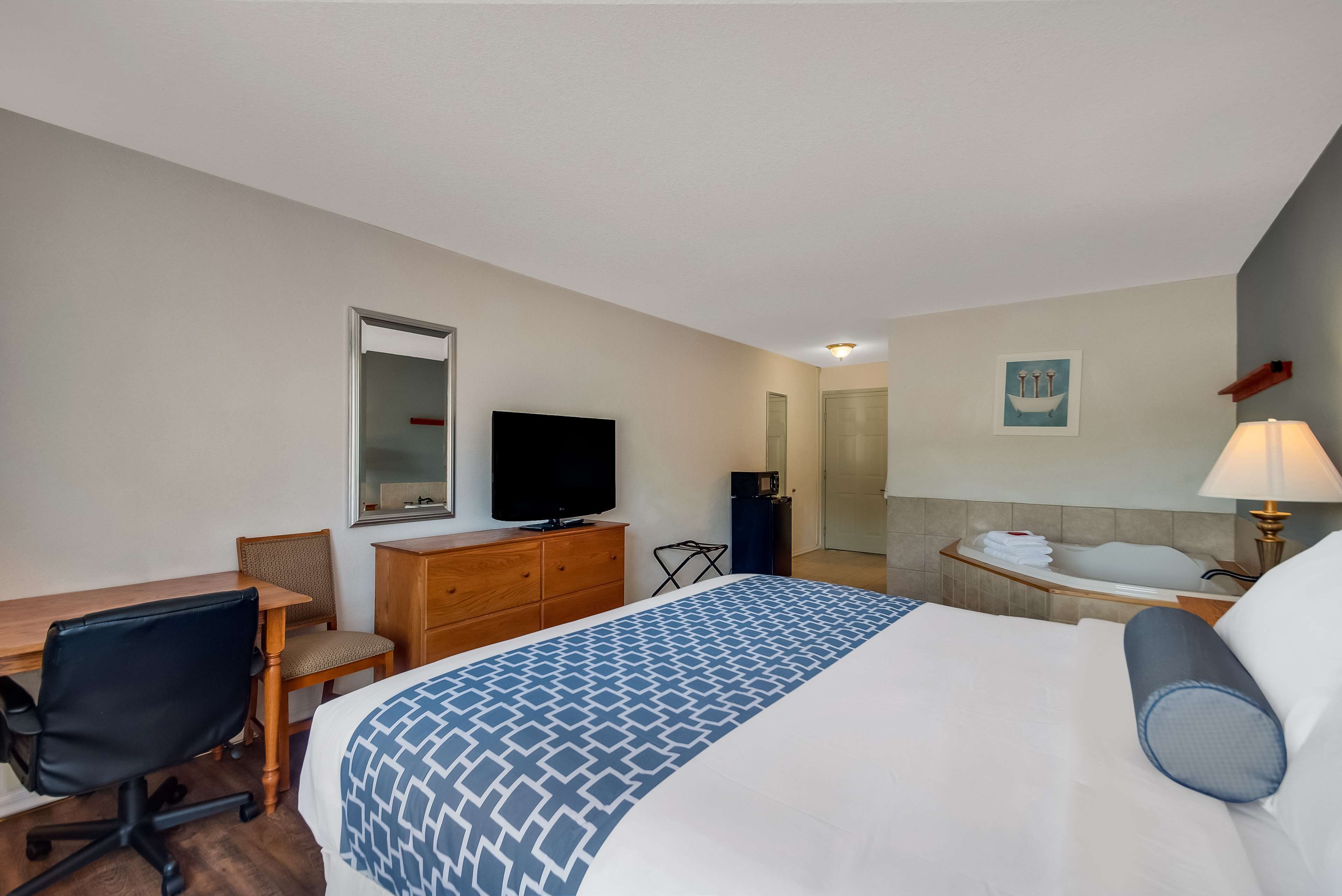 suite, 1 king bed, non smoking, refrigerator & microwave | desk, iron/ironing board, cots/infant beds, rollaway beds