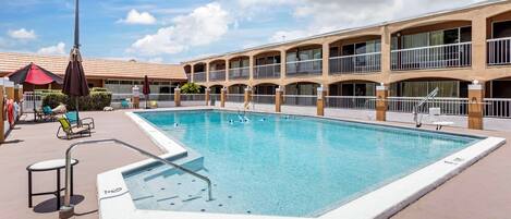 Outdoor pool, open 10:00 AM to 10:00 PM, pool umbrellas, pool loungers