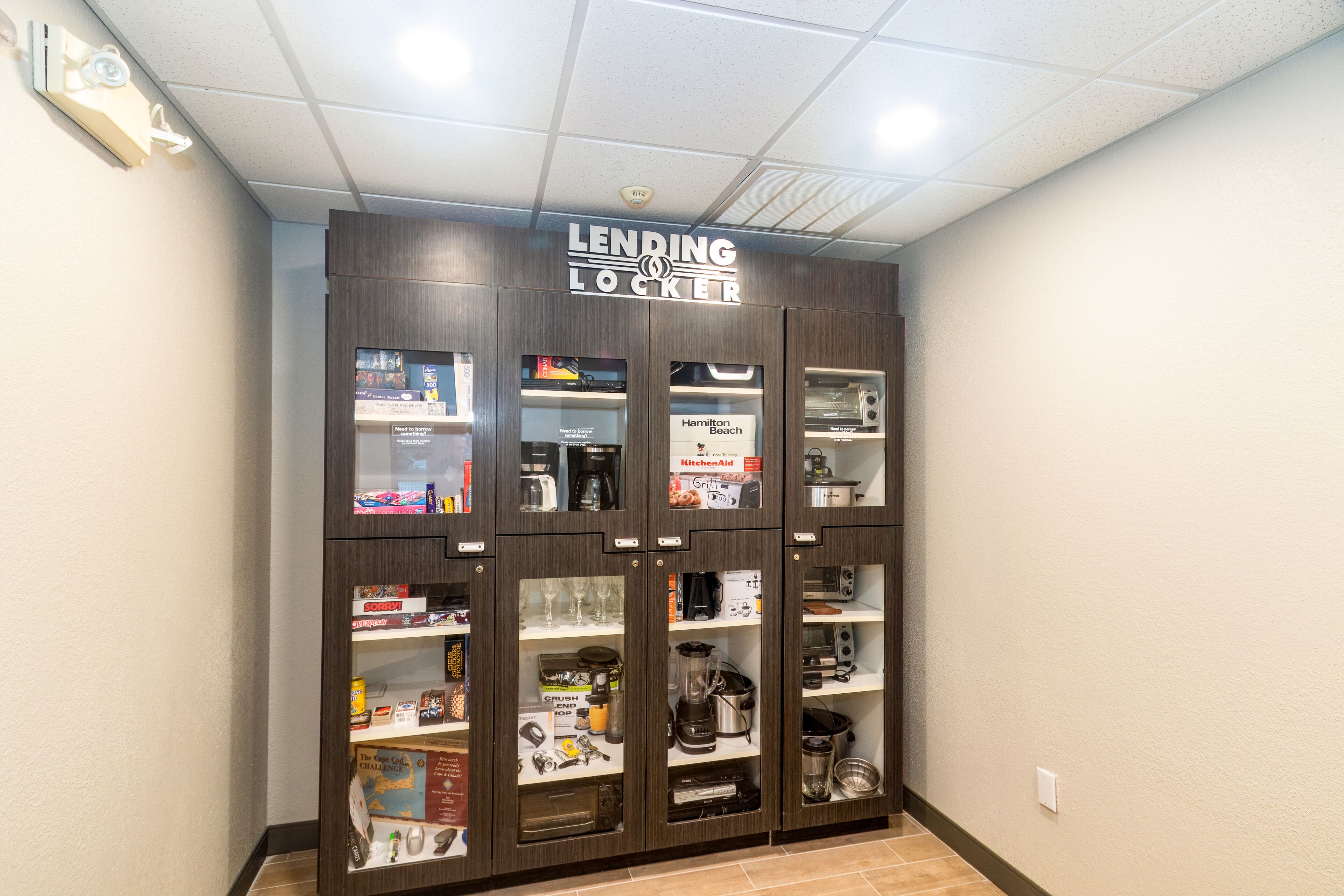 A lending locker with various kitchen appliances and supplies.