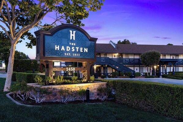 A hotel sign with the name "The Hadsten" and the address "1450".