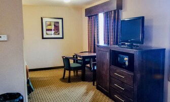 Family Triple Room, Non Smoking | Living area | 32-inch LCD TV with cable channels, TV
