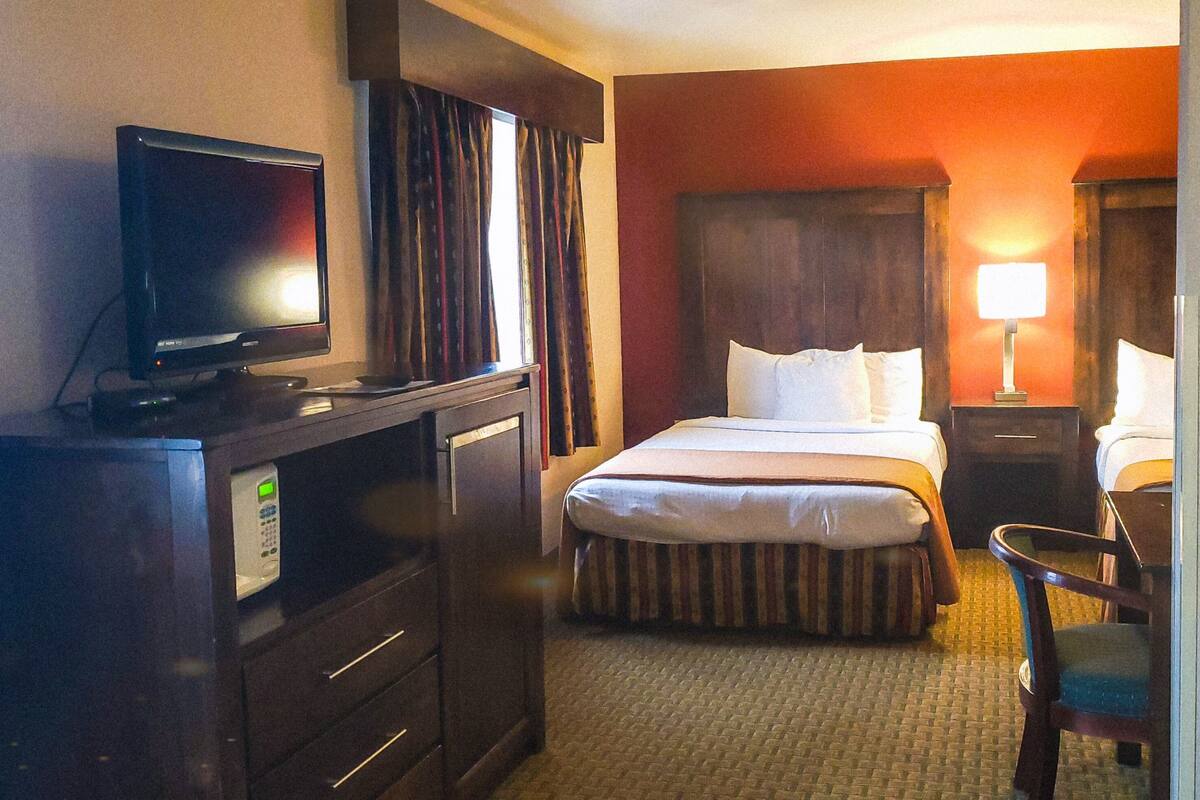 Family Quadruple Room | Living area | 32-inch LCD TV with cable channels, TV
