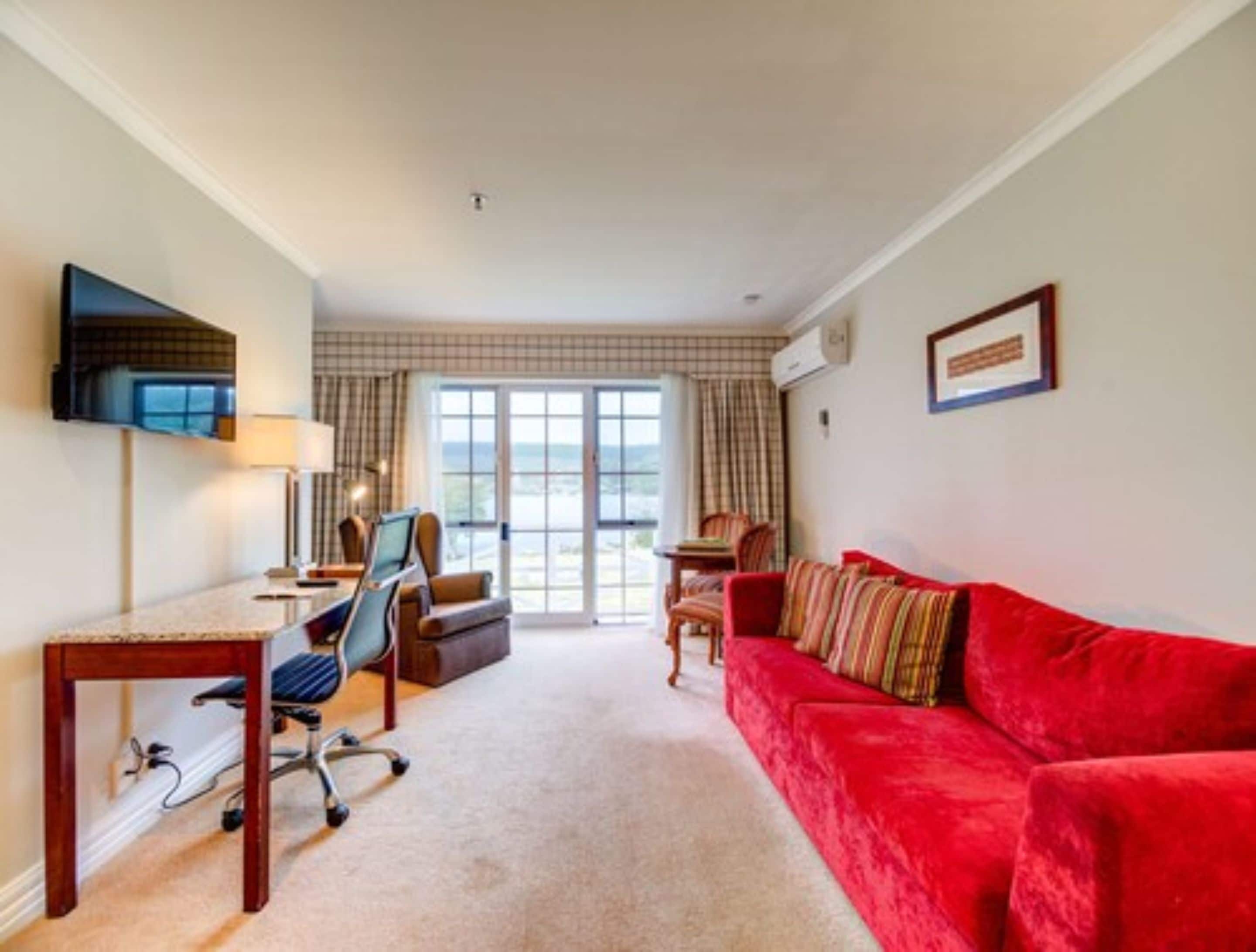 executive suite with spa | living area | 32-inch lcd tv with satellite channels, tv