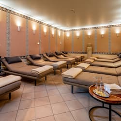 Relax in comfort with plush lounge chairs and a warm ambiance.