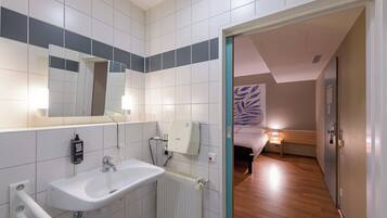 Shower, eco-friendly toiletries, hair dryer, towels