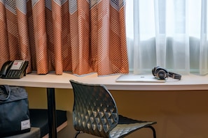Hypo-allergenic bedding, desk, blackout drapes, soundproofing