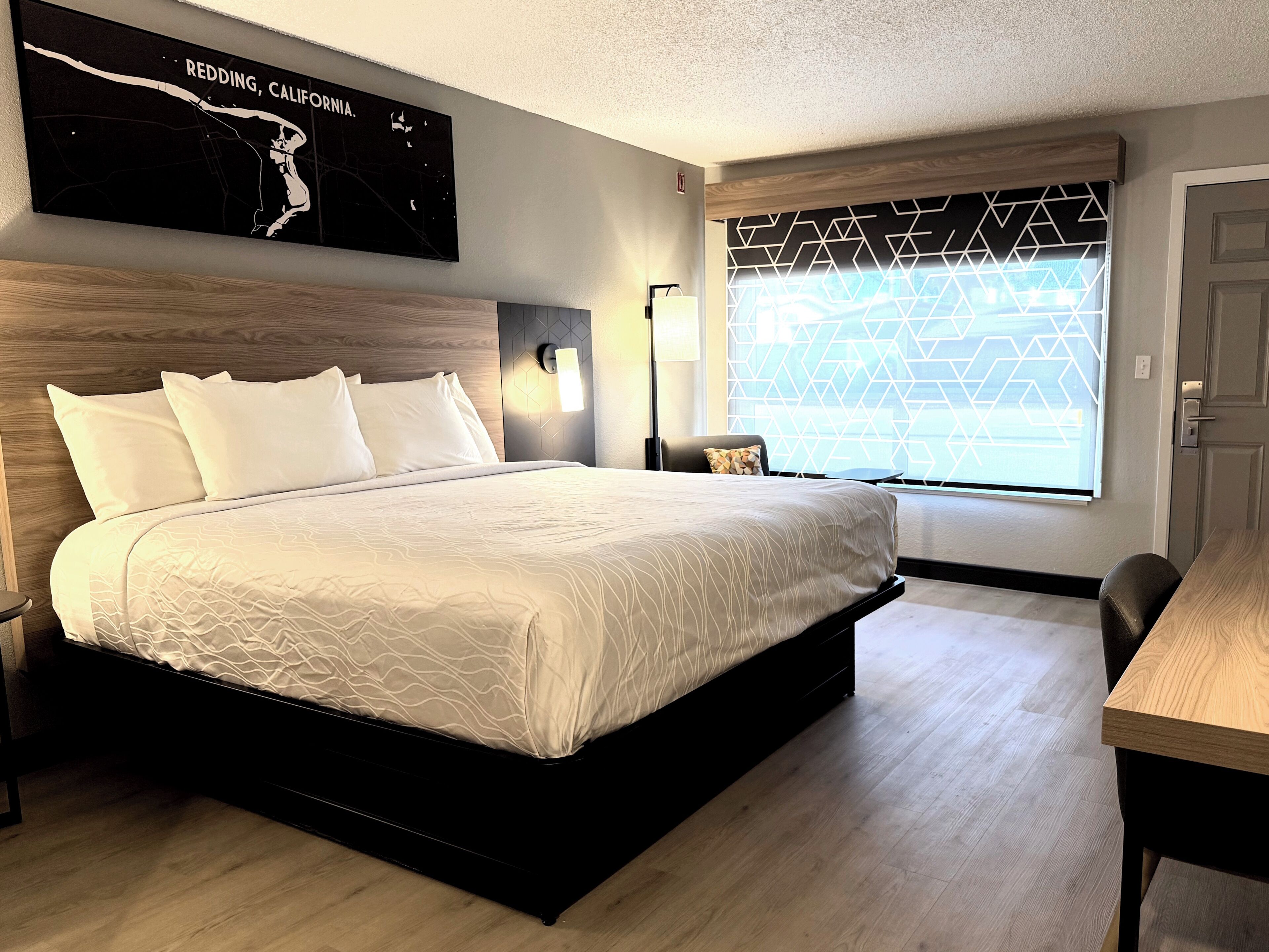 Desk, laptop workspace, blackout drapes, iron/ironing board