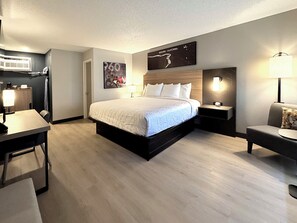 Desk, laptop workspace, blackout drapes, iron/ironing board