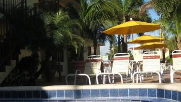 Outdoor pool, open 9:00 AM to 8:00 PM, sun loungers