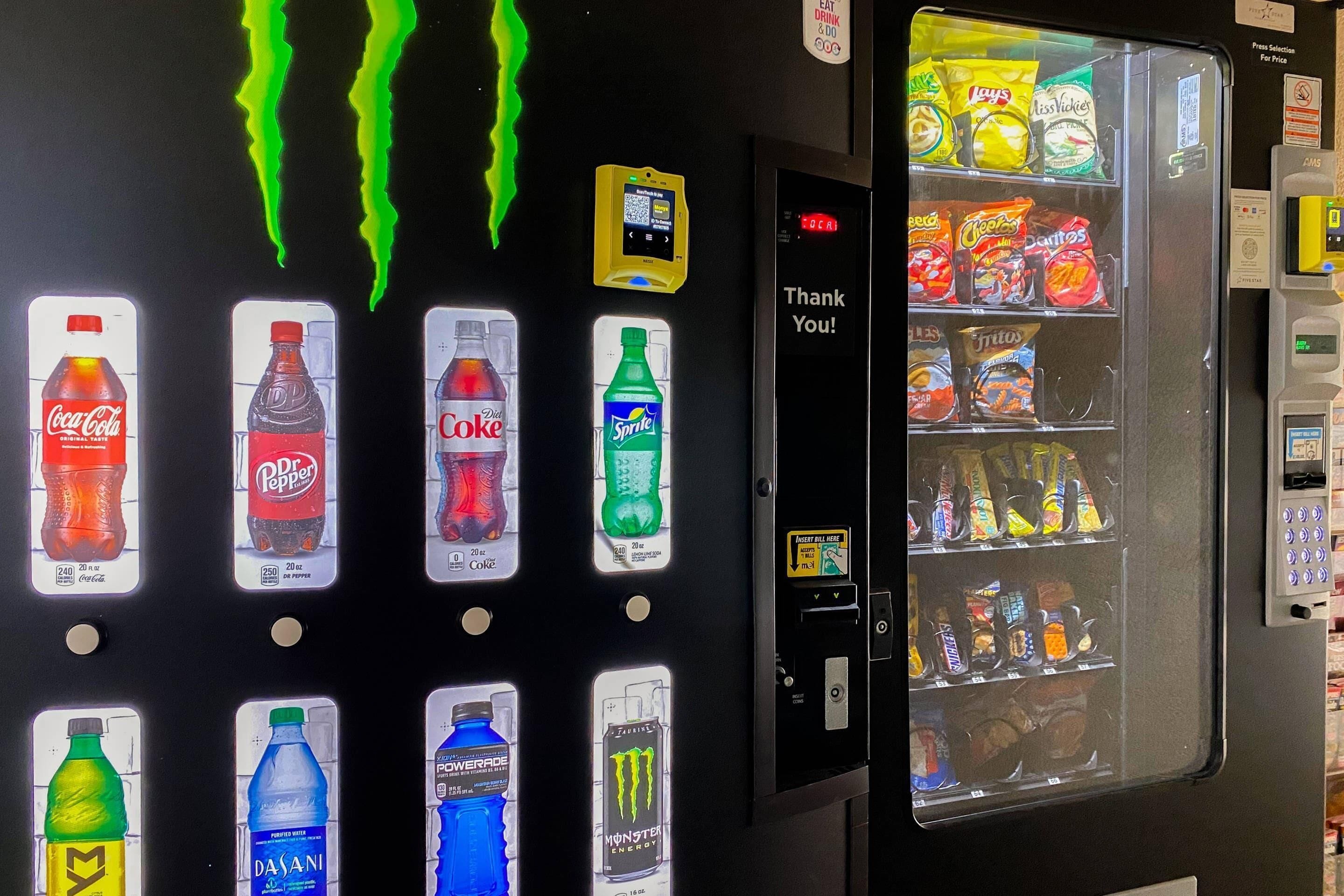 A vending machine with various drinks and snacks, including Coca-Cola, Dr. Pepper, Sprite, and Doritos.