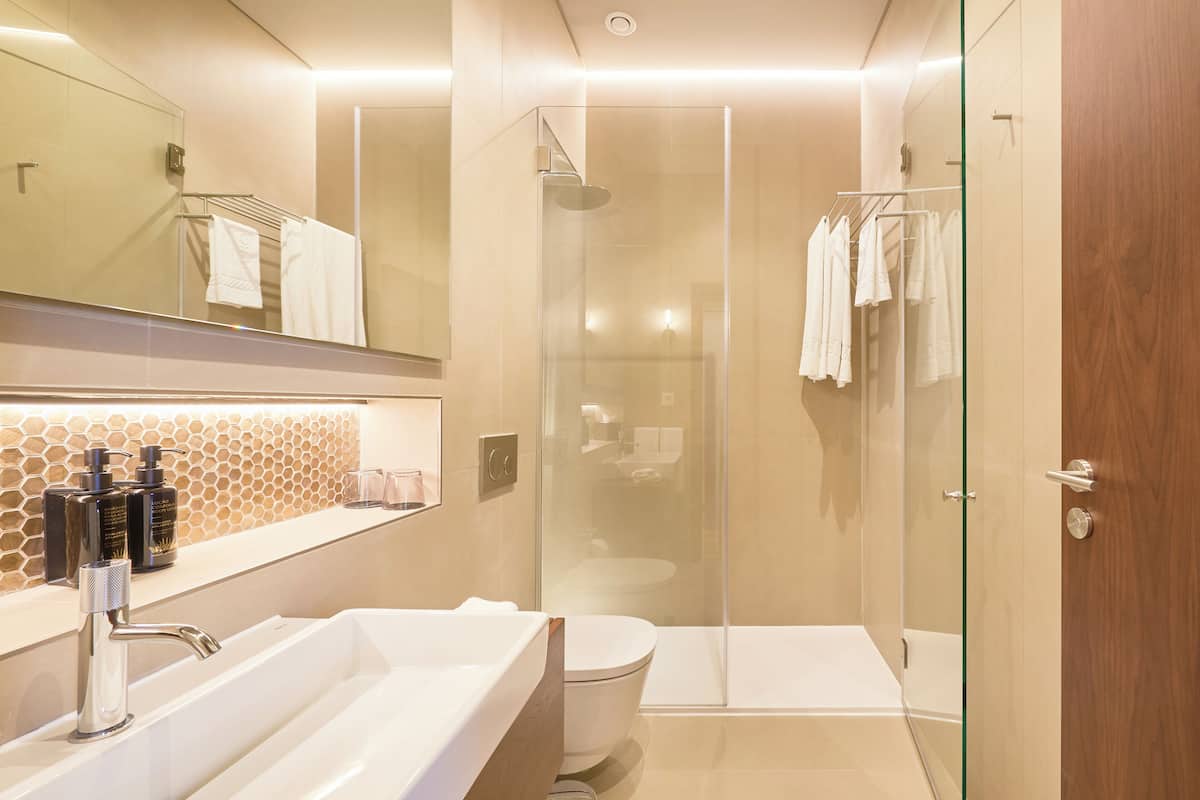 standard double room | bathroom | shower, designer toiletries, hair dryer, bathrobes