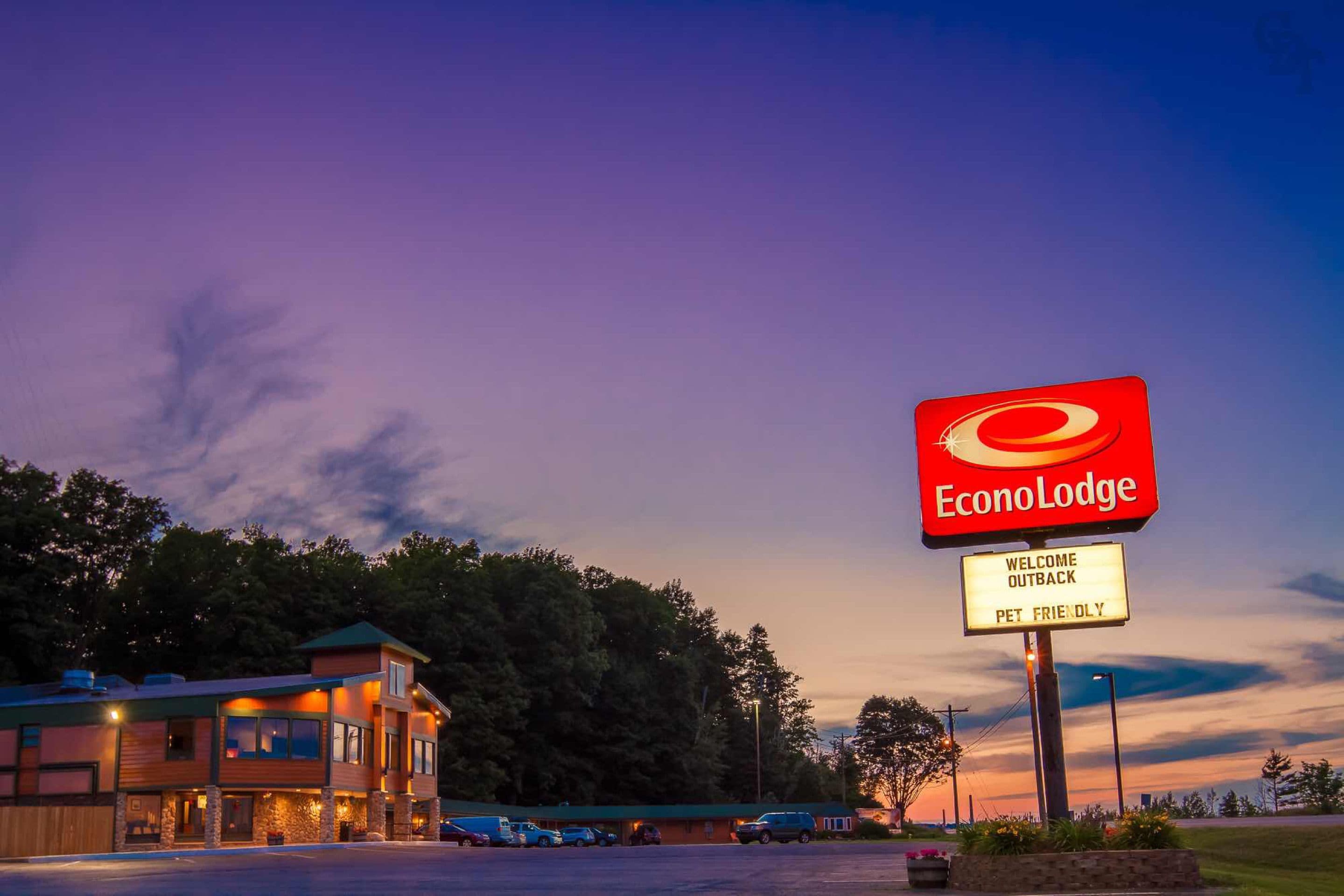 A hotel named EconoLodge with a sign indicating it is pet-friendly.