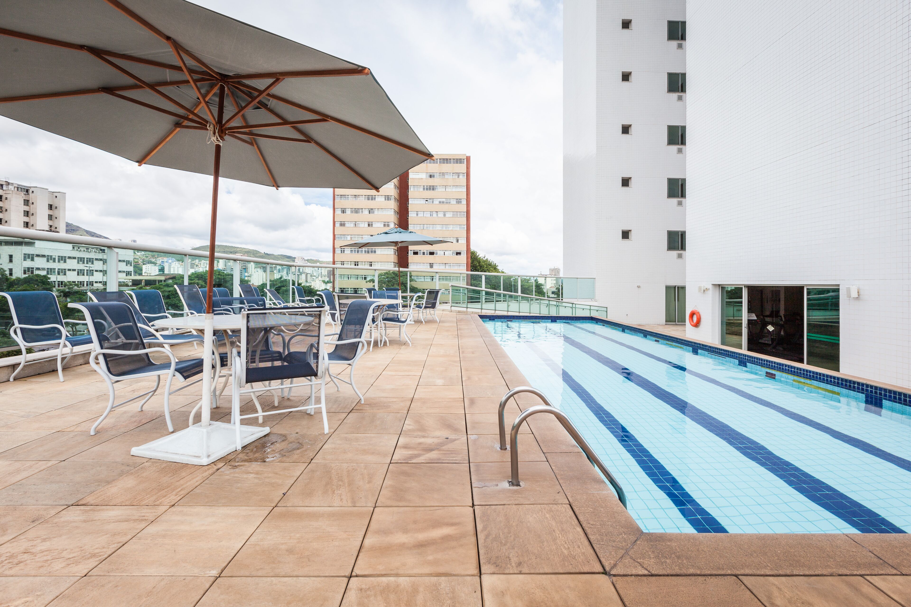 outdoor pool, open 6:00 am to 10:00 pm, pool umbrellas, pool loungers