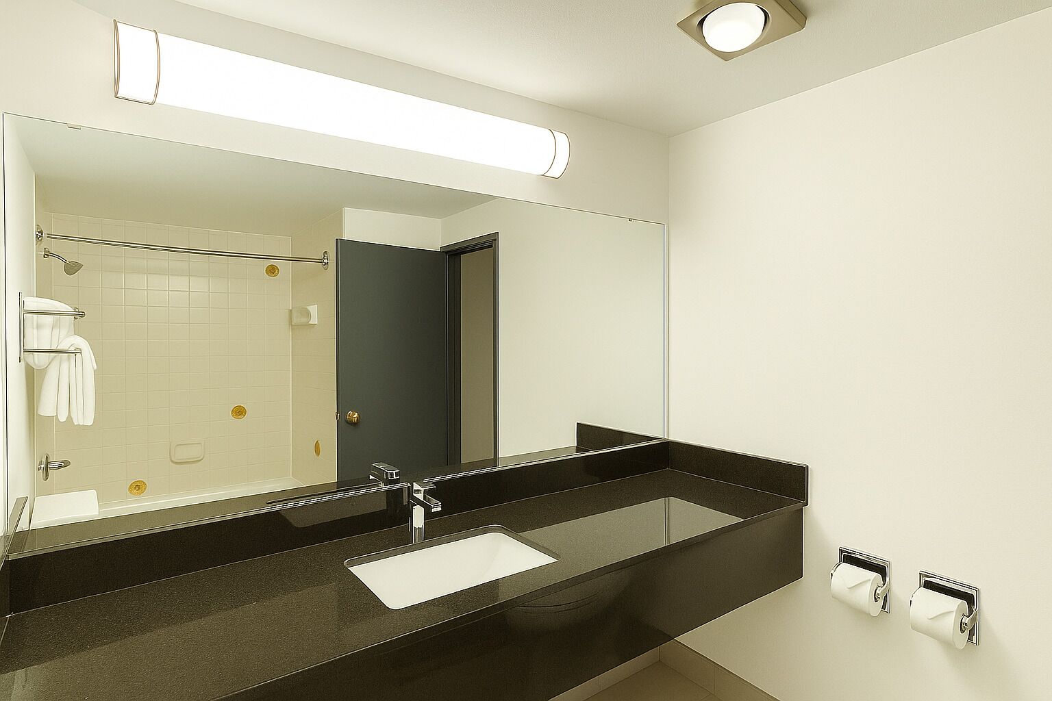 A modern bathroom with a large mirror, a black countertop, a white sink, and a shower area.