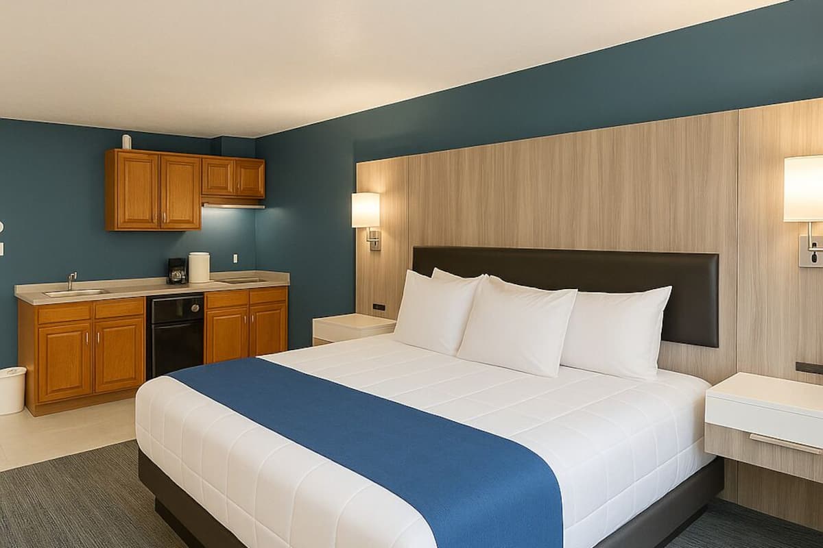 Suite, Kitchenette | Desk, blackout drapes, iron/ironing board, cribs/infant beds