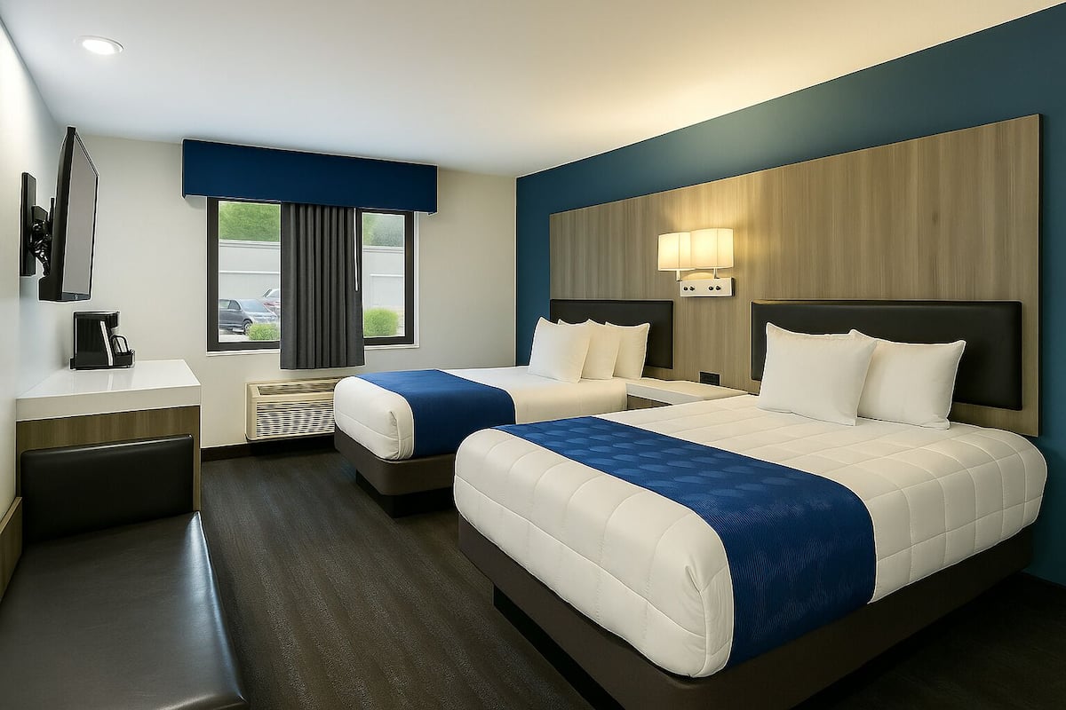 Deluxe Two Queen Studio | Blackout drapes, iron/ironing board, WiFi, bed sheets