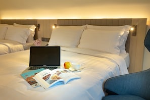 Deluxe Quadruple Room, 2 Double Beds | In-room safe, desk, laptop workspace, blackout curtains