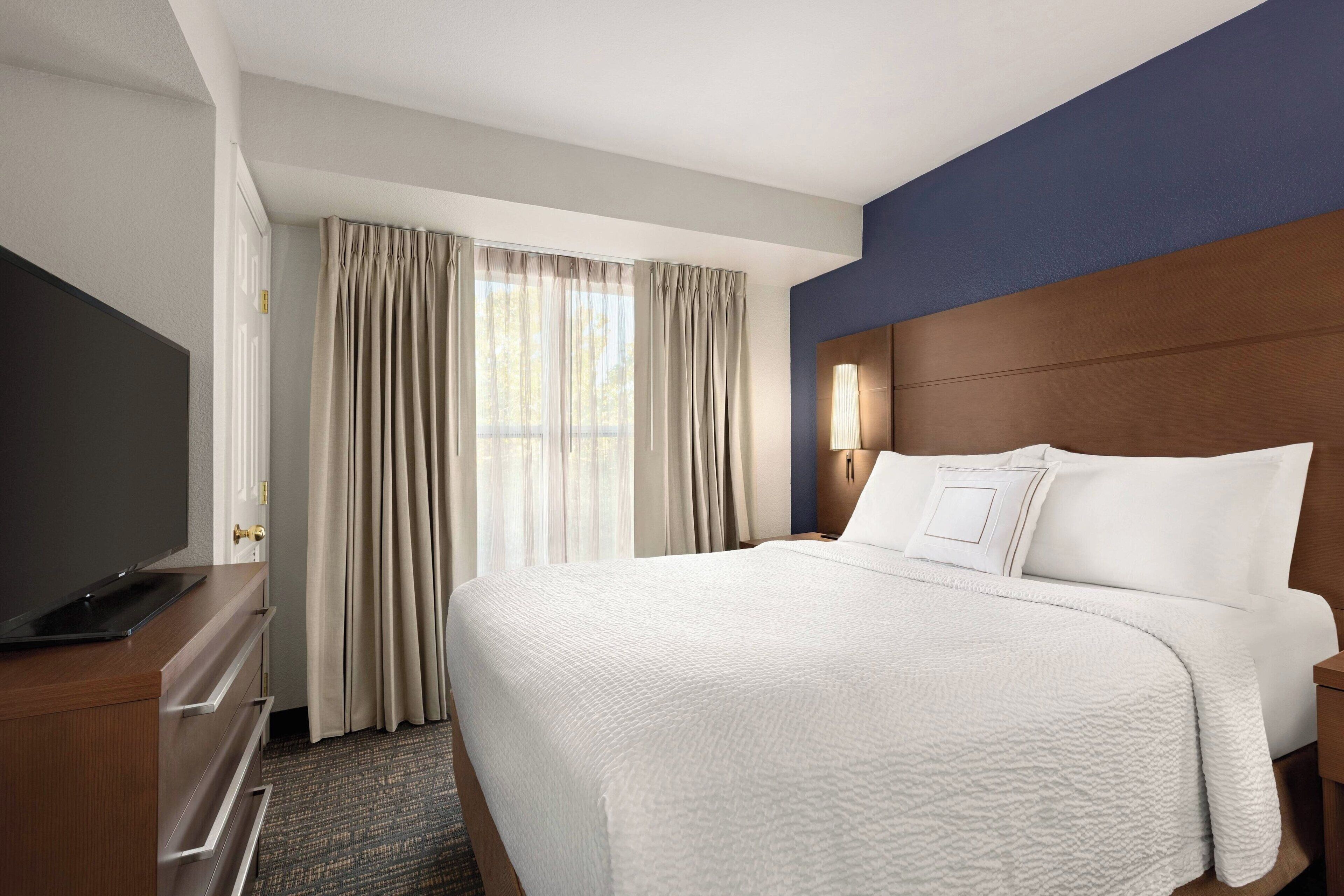 desk, laptop workspace, blackout curtains, iron/ironing board