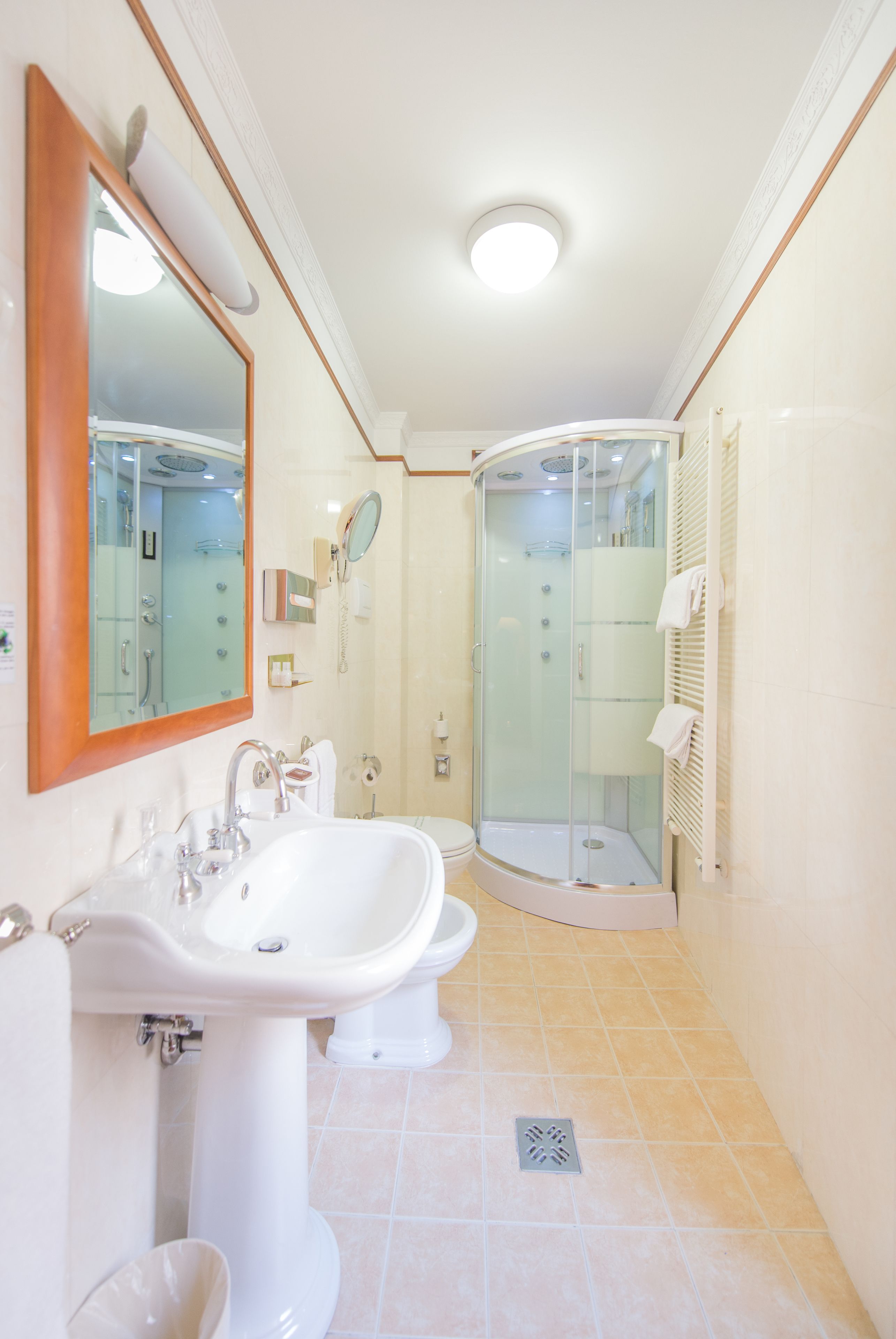 hair dryer, slippers, bidet, towels