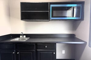 Suite, 1 King Bed, Non Smoking | Desk, laptop workspace, iron/ironing board, free WiFi - Super 8 by Wyndham Clinton/Jackson West (Clinton)