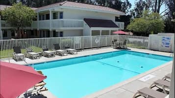 Outdoor pool, open 9:00 AM to 9:00 PM, pool umbrellas