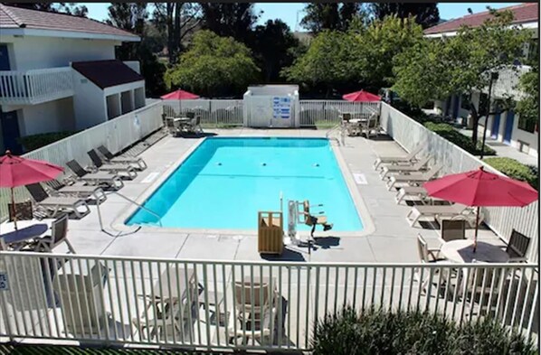 Outdoor pool, open 9:00 AM to 9:00 PM, pool umbrellas
