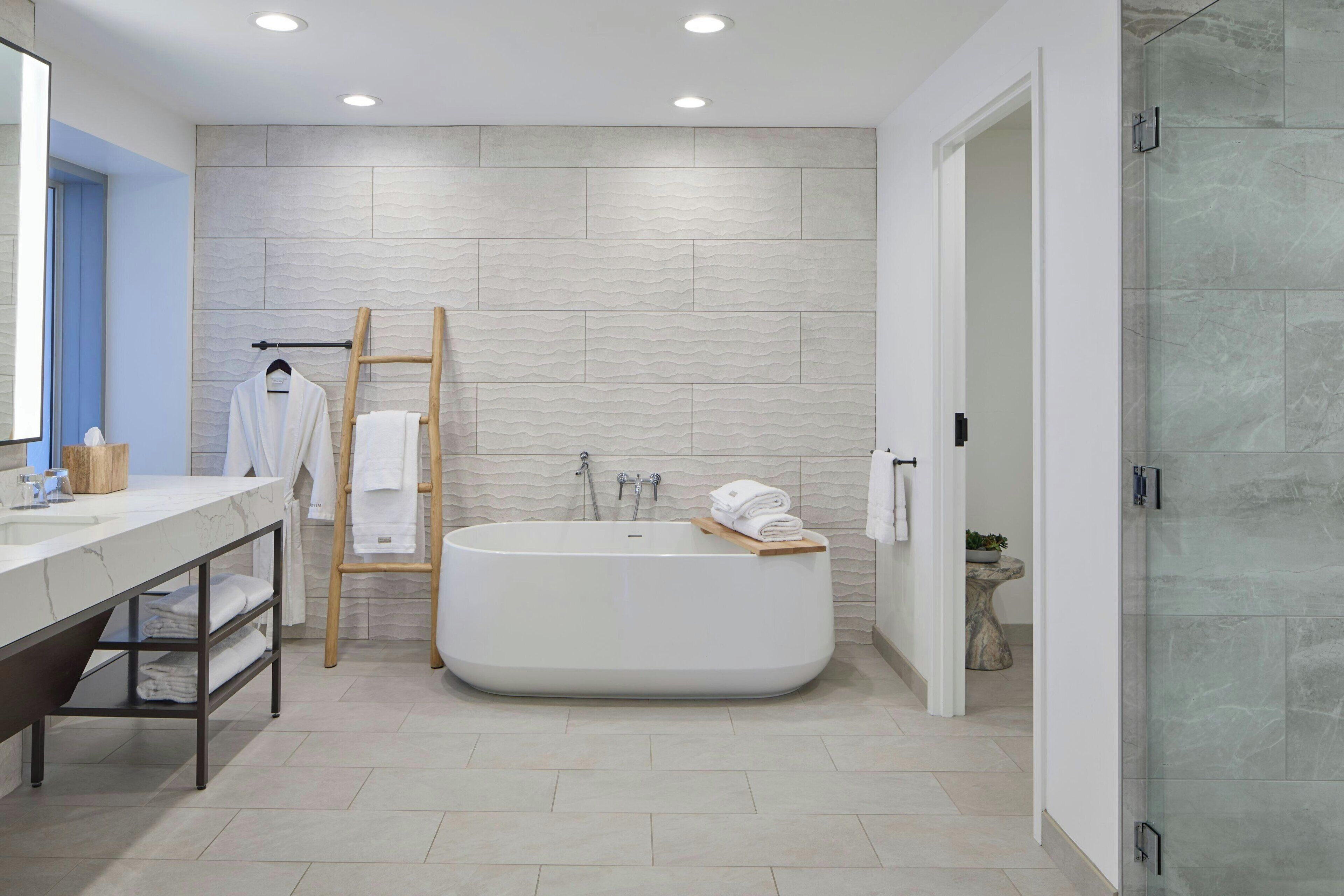 combined shower/bathtub, rainfall showerhead, hair dryer, bathrobes