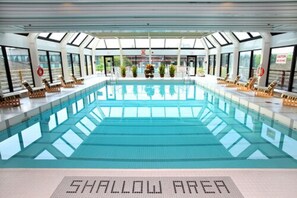 Indoor pool, seasonal outdoor pool, pool umbrellas, pool loungers