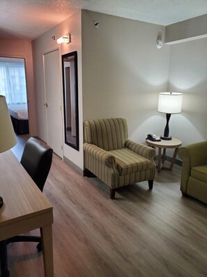 Suite, 1 Bedroom, Non Smoking | Living room | 43-inch LED TV with cable channels, TV, books