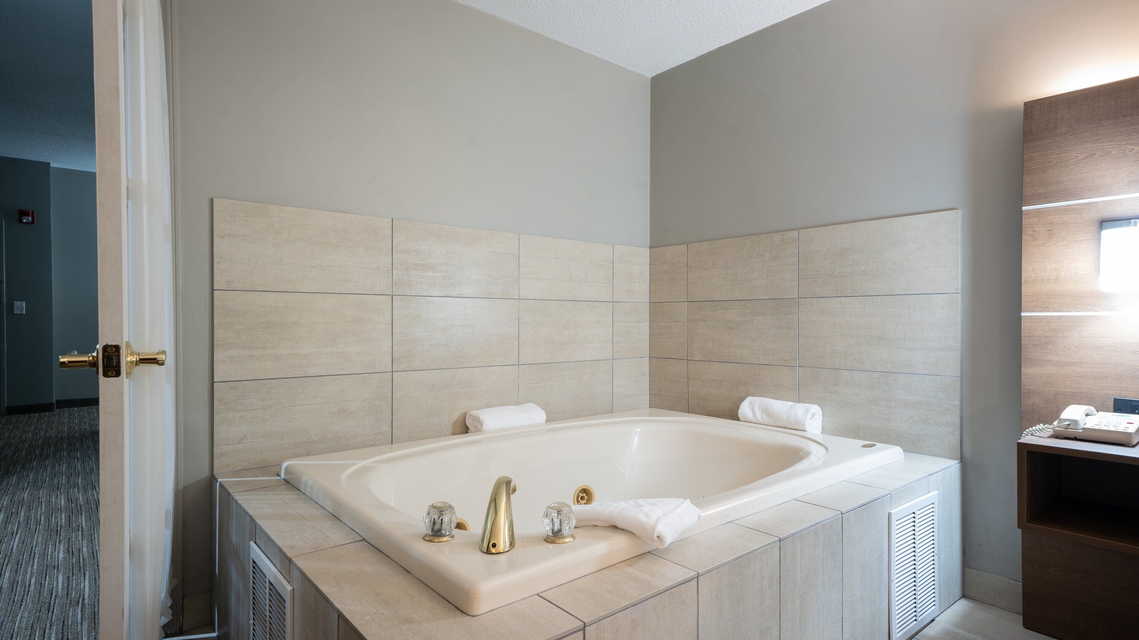 suite, 1 bedroom, jetted tub | in-room safe, desk, iron/ironing board, free rollaway beds