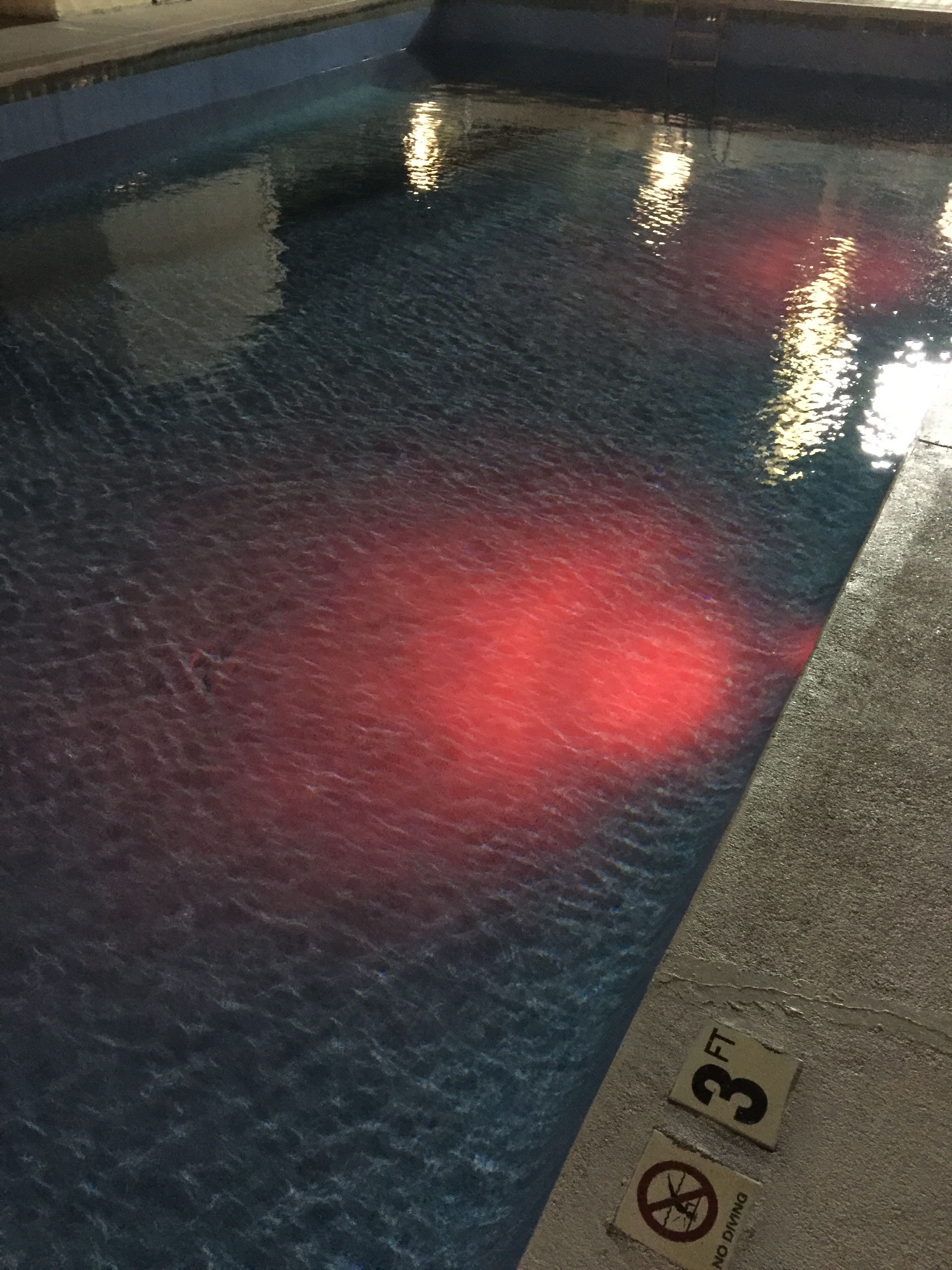 A swimming pool with a 3 FT depth marker and a 'No Diving' sign.