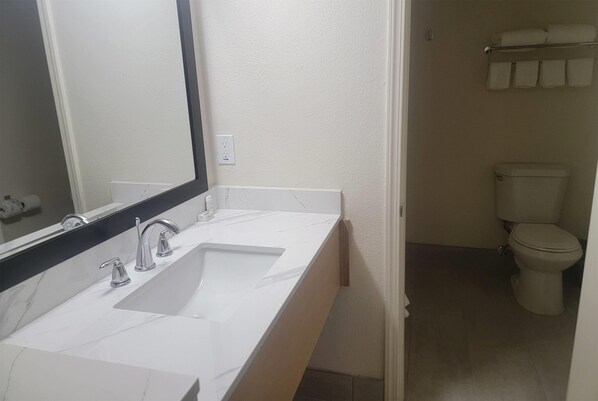 Combined shower/bathtub, hair dryer, towels, soap