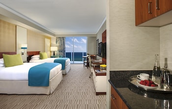 Premium bedding, pillowtop beds, minibar, in-room safe at Trump International Beach Resort