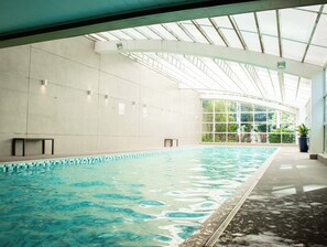 Indoor pool, pool umbrellas, sun loungers