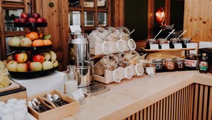 A breakfast buffet with various fruits, cereals, and condiments. - Hotel Prinzregent München (Munich)