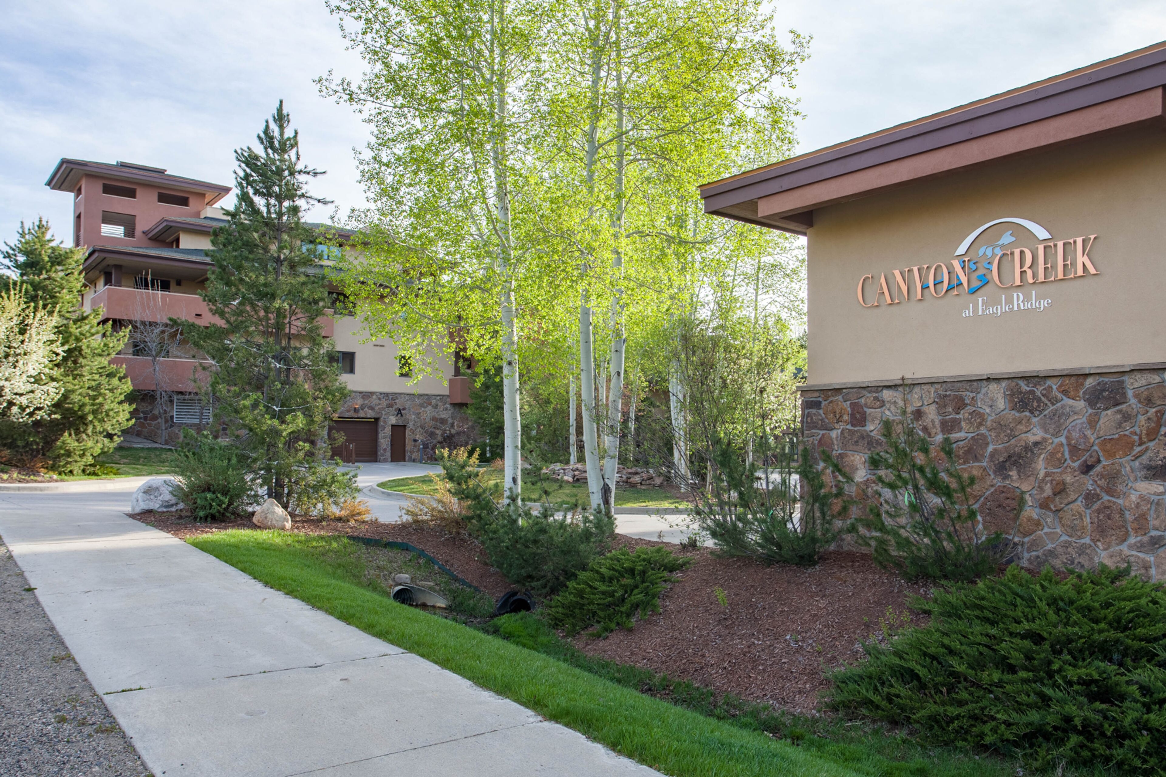 A building with a sign reading "Canyon Creek at Eagle Ridge."