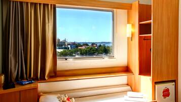 Standard Room, Multiple Beds | Minibar, desk, laptop workspace, blackout drapes