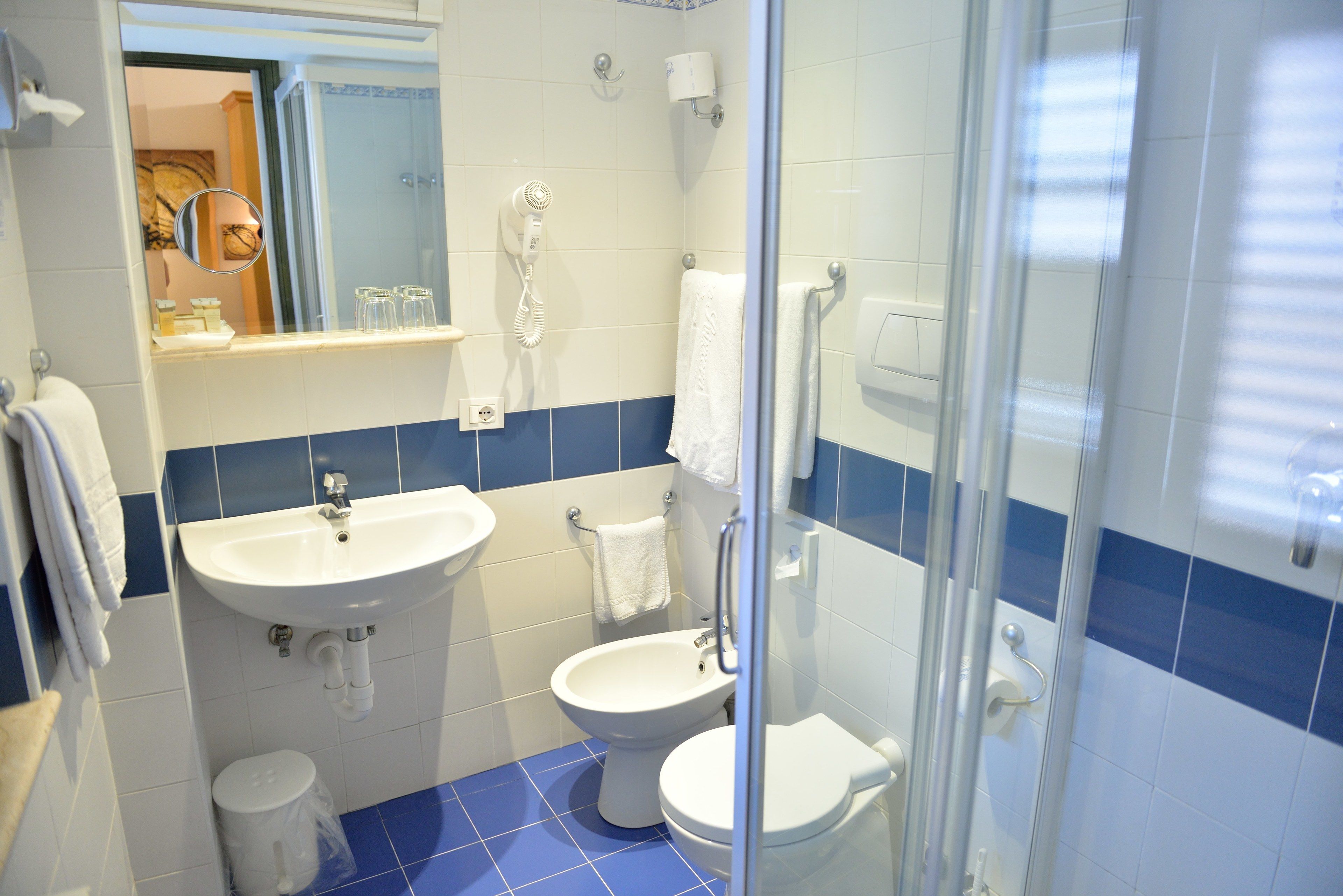 economy double room | bathroom | shower, designer toiletries, hair dryer, towels