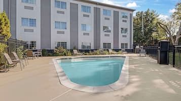 Seasonal outdoor pool, open 9:00 AM to 9:00 PM, pool umbrellas