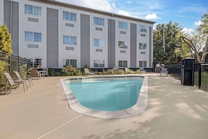 Seasonal outdoor pool, open 9:00 AM to 9:00 PM, pool umbrellas
