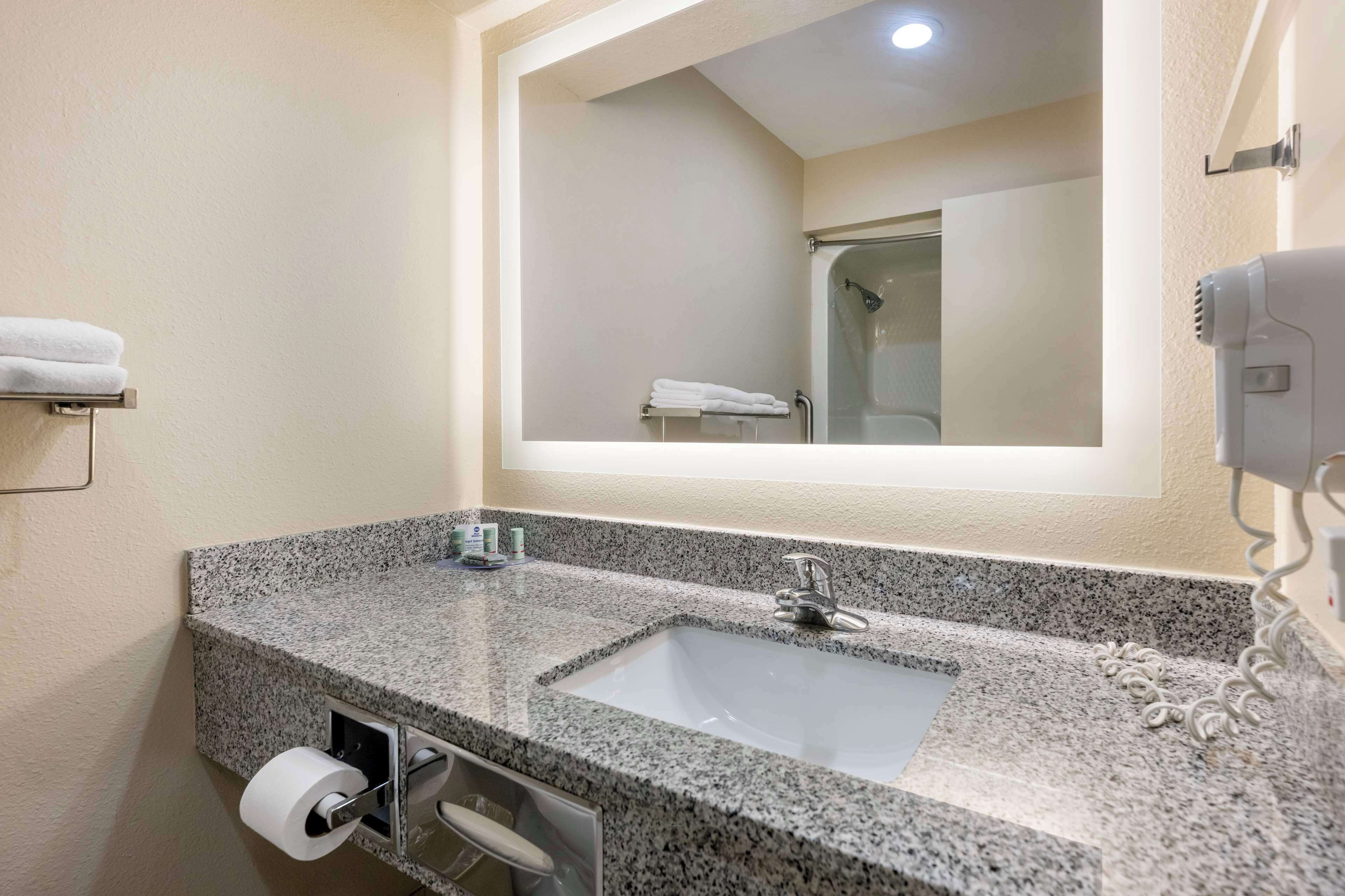 combined shower/bathtub, hair dryer, towels, soap